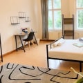 How often are the private rooms cleaned and maintained in a coliving space?